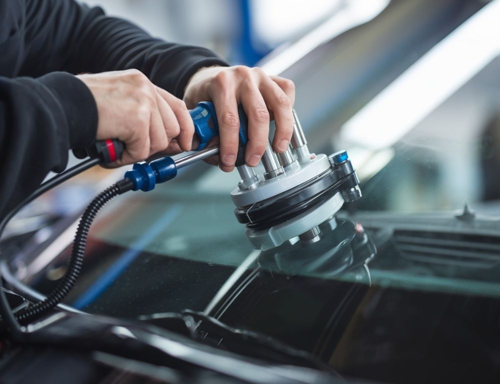 Auto body Technician repair glass at Collision Boss Auto body Technician repair glass at Collision-Boss